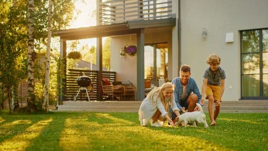 Family Happy In Back Yard At Home