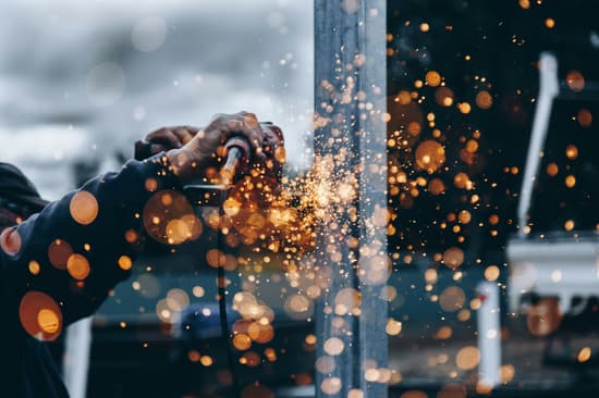 Contractor holding tool with sparks flying