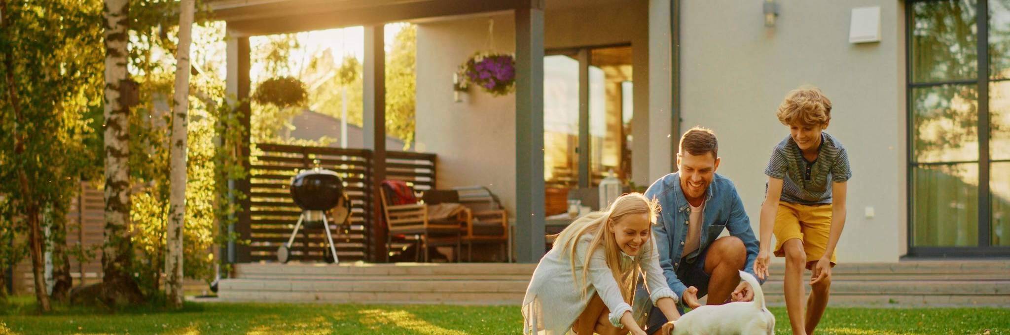 Family Happy In Back Yard At Home