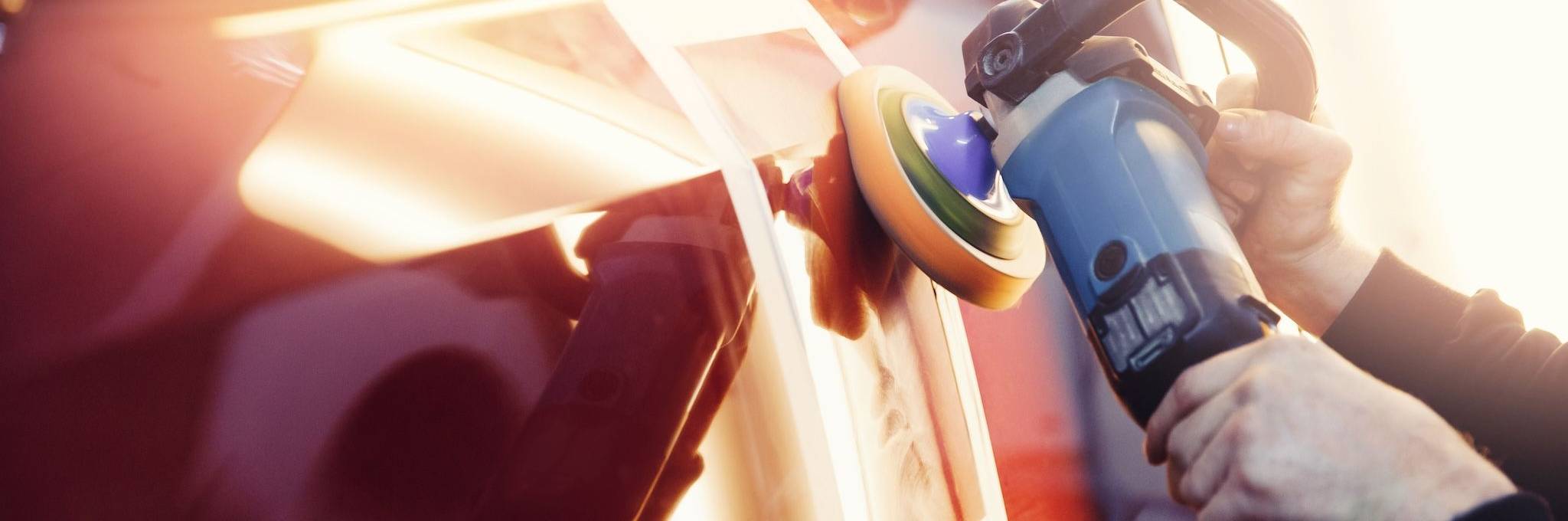 Body Shop repairing paint on a car