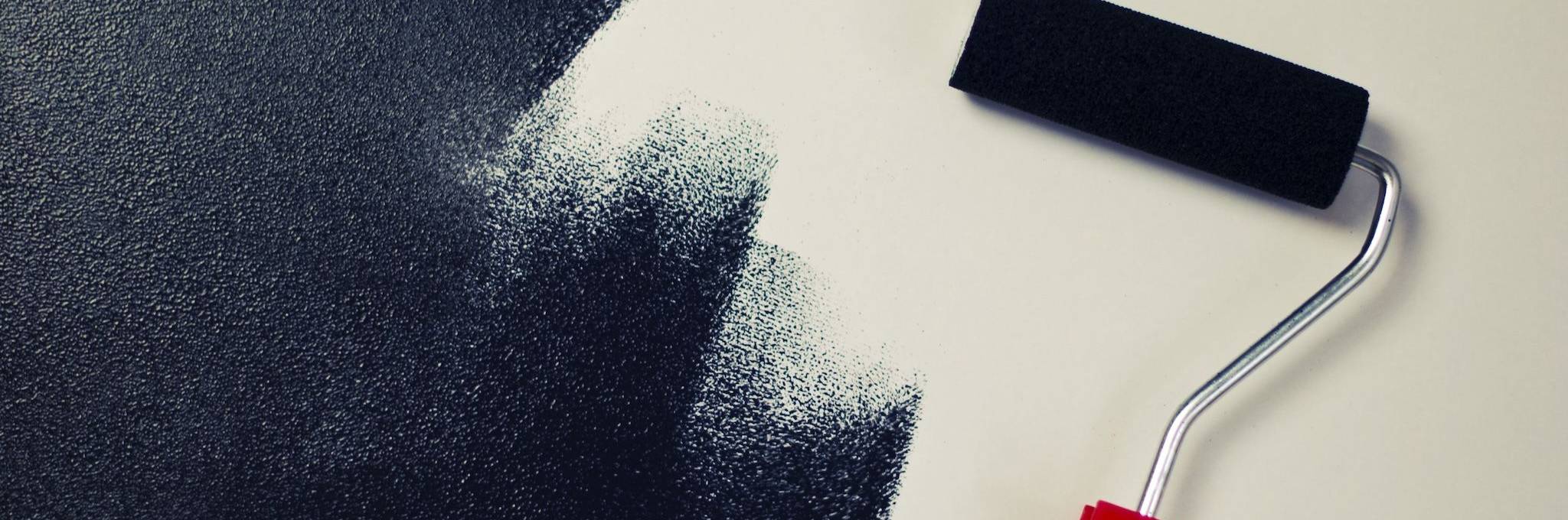 White wall being painted black