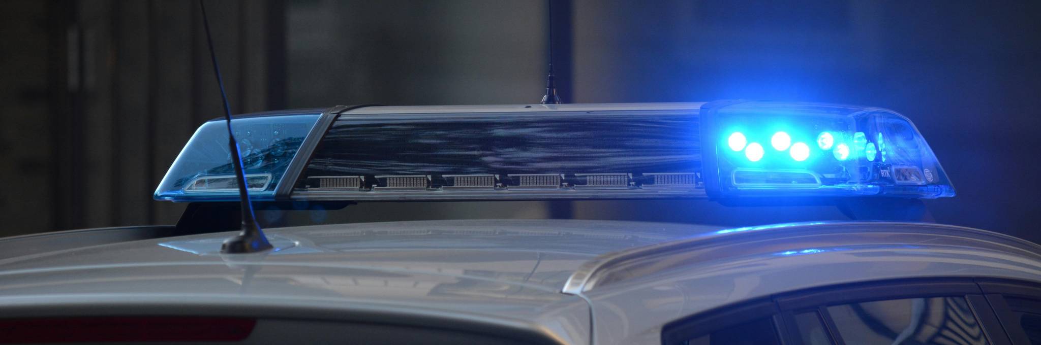 Police sirens going off on top of car
