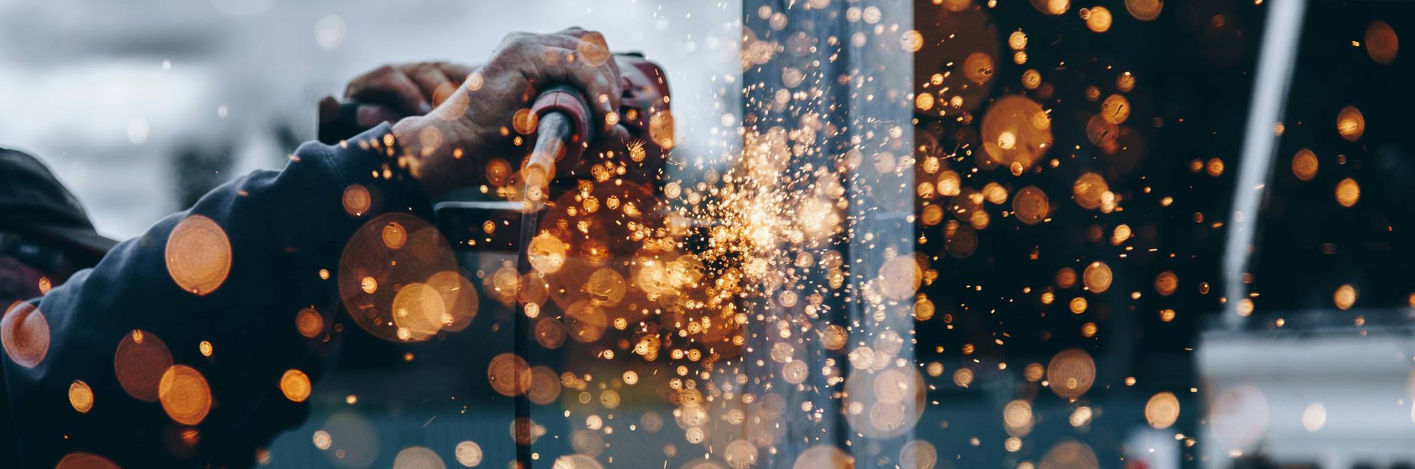 Contractor holding tool with sparks flying
