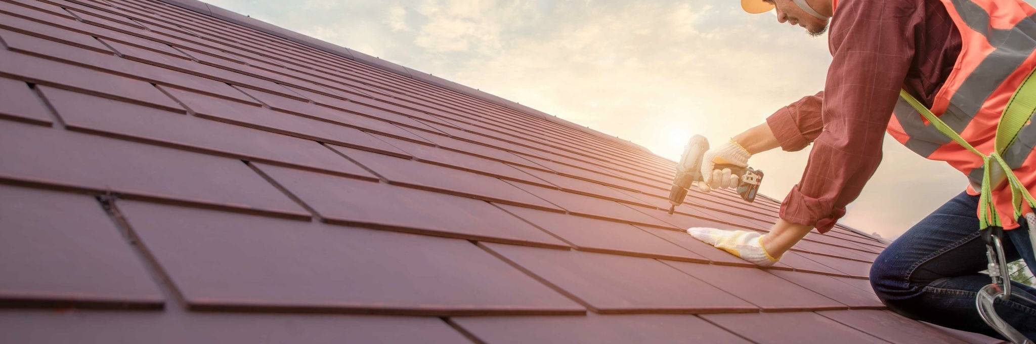 Roofing Contractor working on roof needs insurance