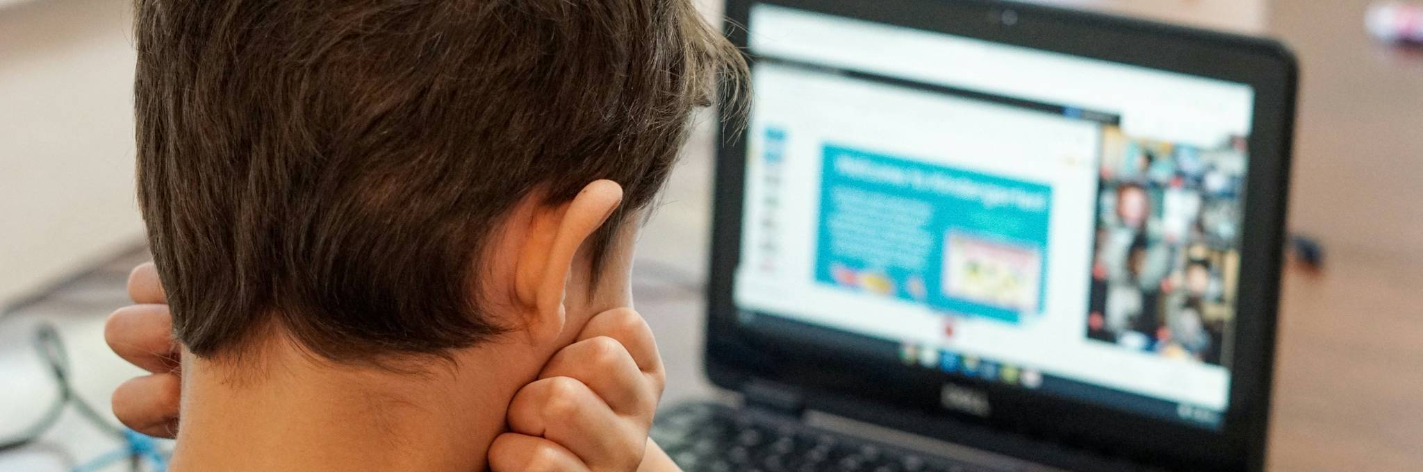 frustrated looking at laptop
