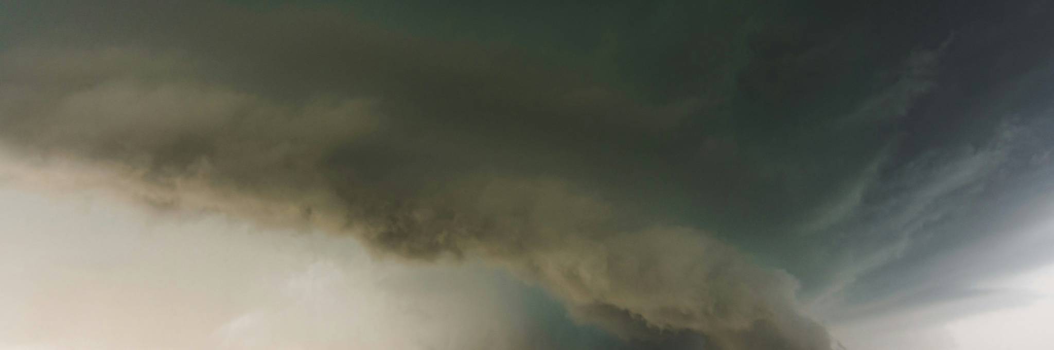 Tornado descending on field
