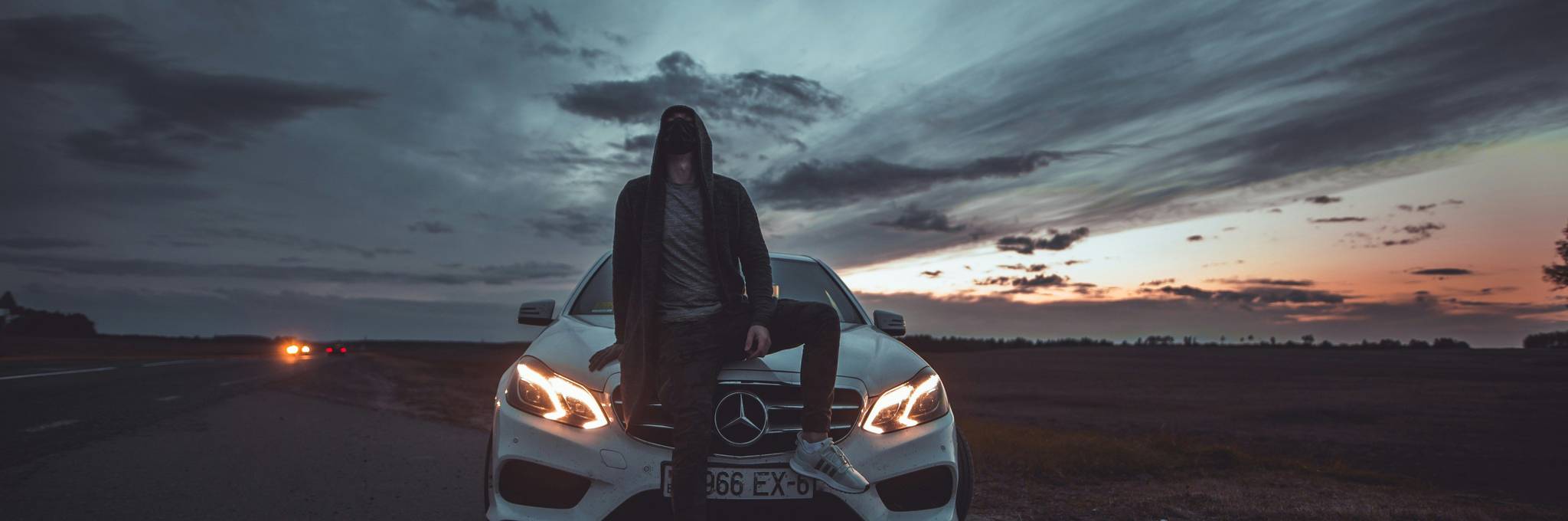 Car Thief Sitting on Car