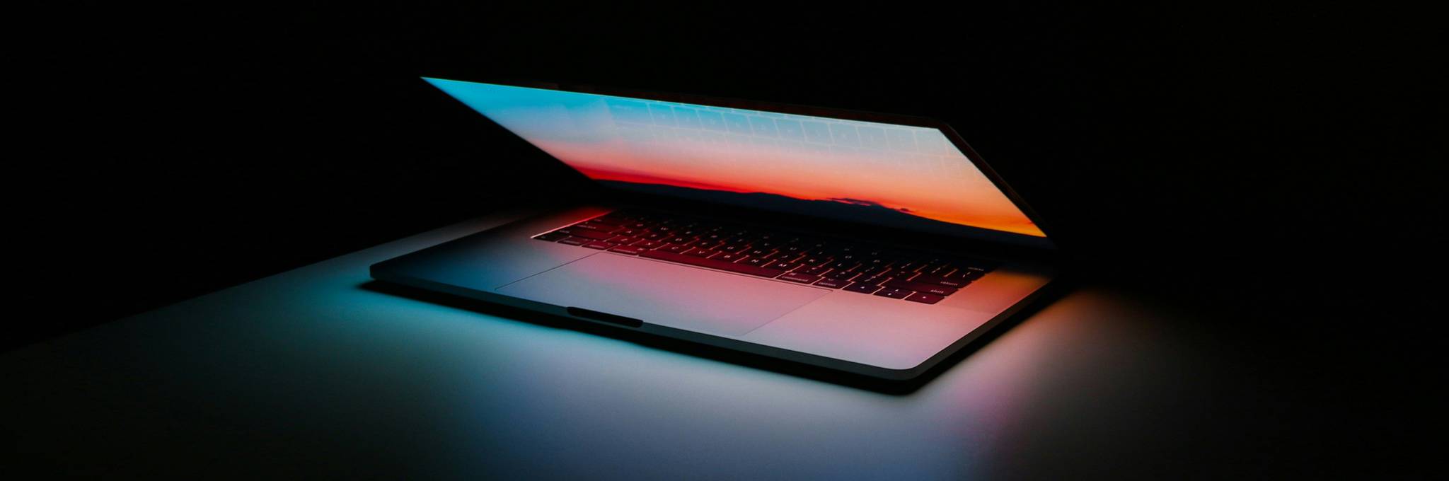 laptop half open and glowing