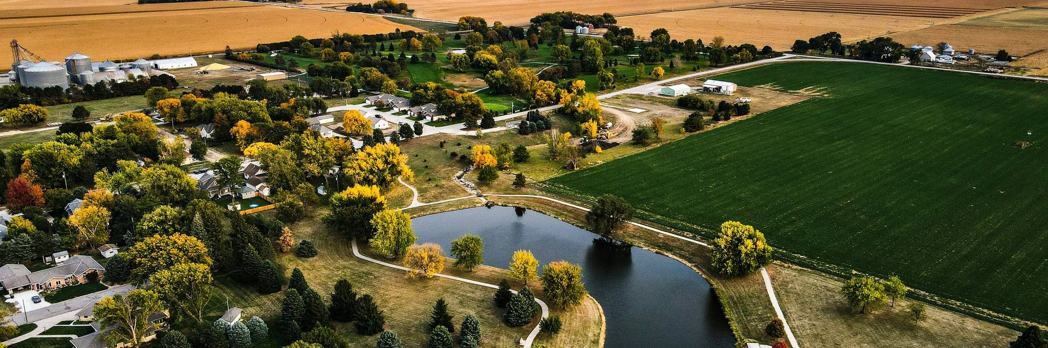 arial view of homes and field