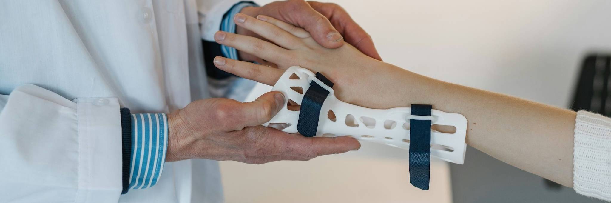 doctor helping with sprained wrist
